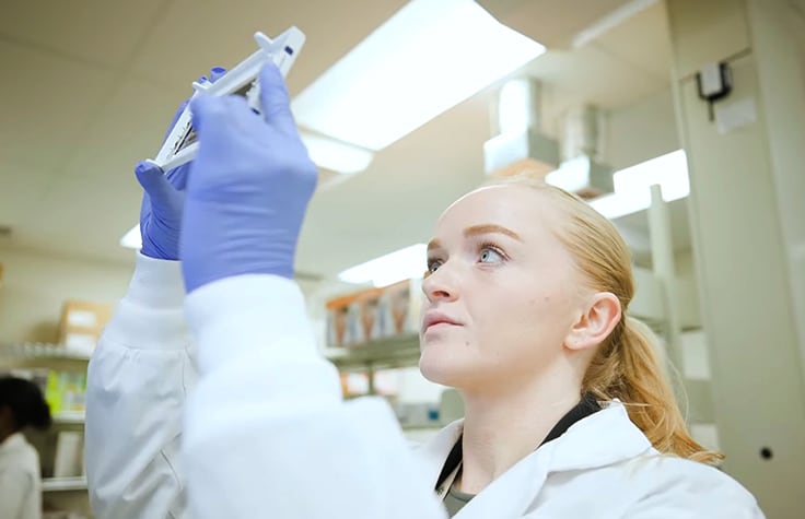 Understanding cancer biology female scientist