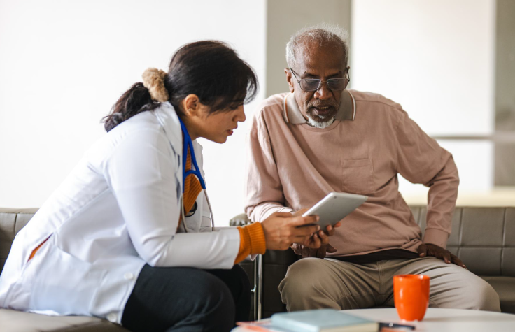 Doctor and patient conferring over test results.
