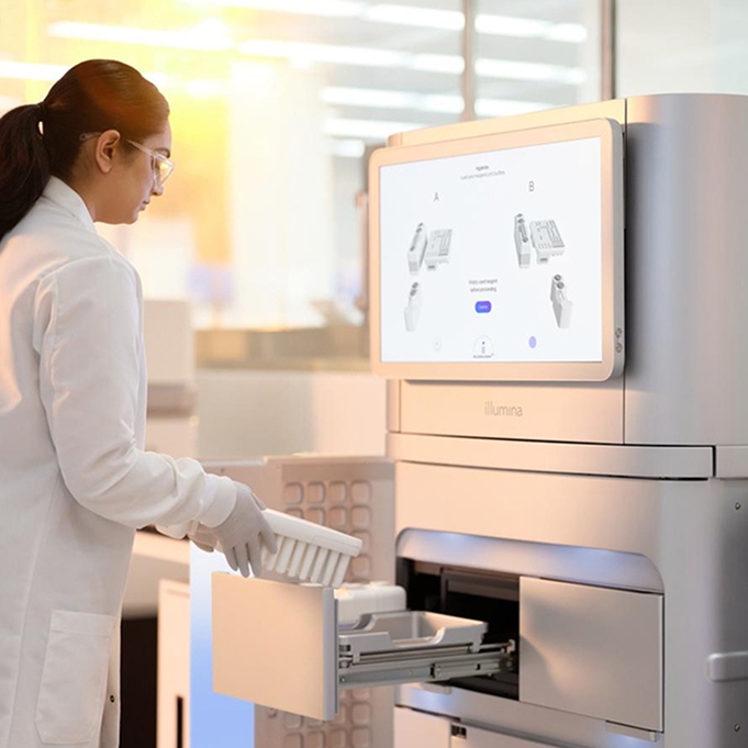 scientist loading reagents into novaseq x instrument